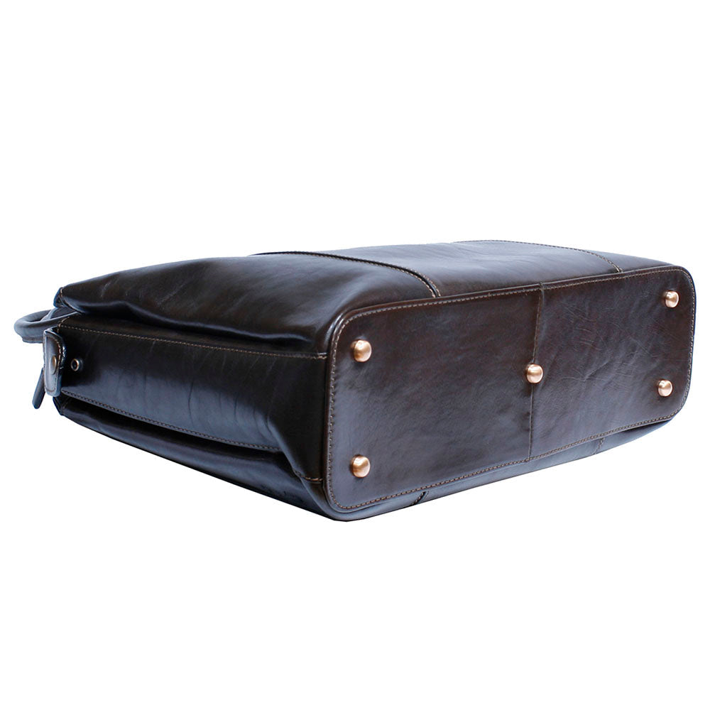 Base of the Tony Perotti Italico 9715-40 moro leather laptop bag — bronze metal feet set into the leather and contrasting beige stitching along the seams
