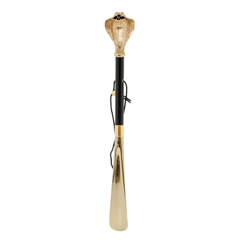 Full-length Pasotti shoehorn with a gold-colored cobra handle shown upright