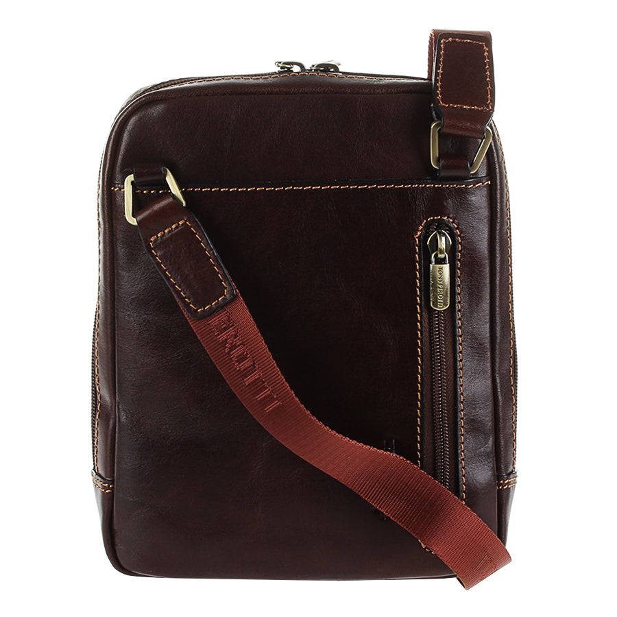 Back of the dark brown Tony Perotti Italico 9984 — vertical rear zip pocket with branded brass puller and terracotta textile strap