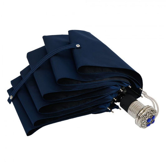 Folded navy blue umbrella with decorative handle on a white background