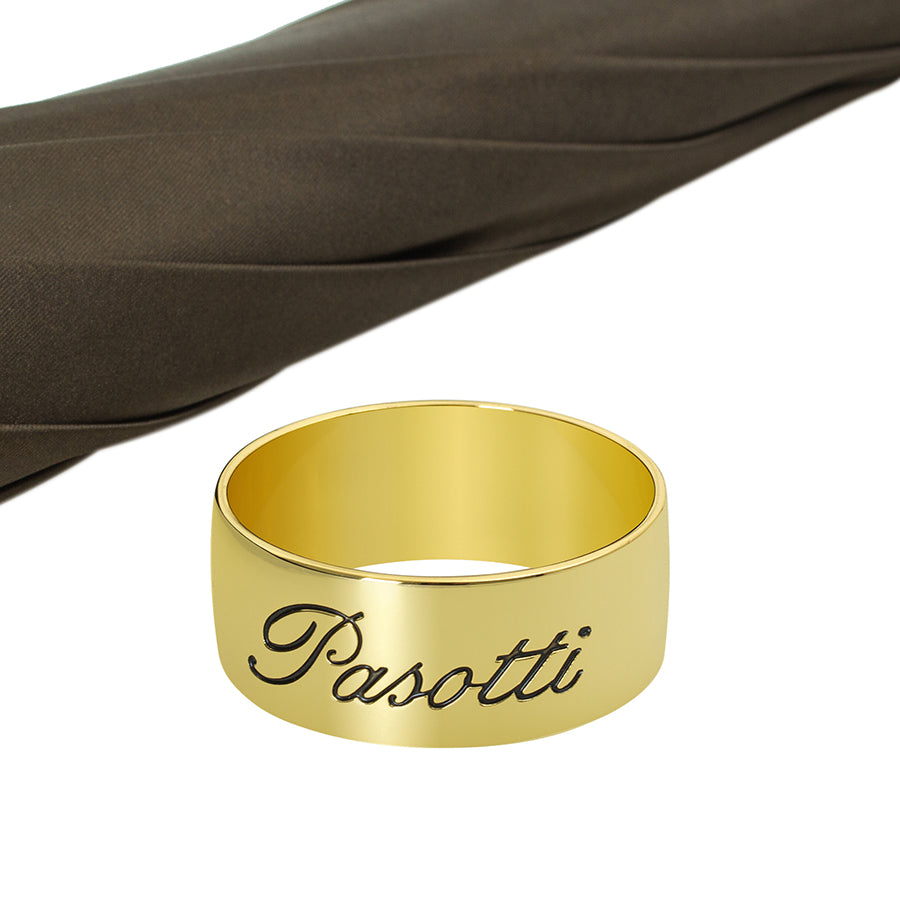 Gold ring with 'Pasotti' engraving on a white background