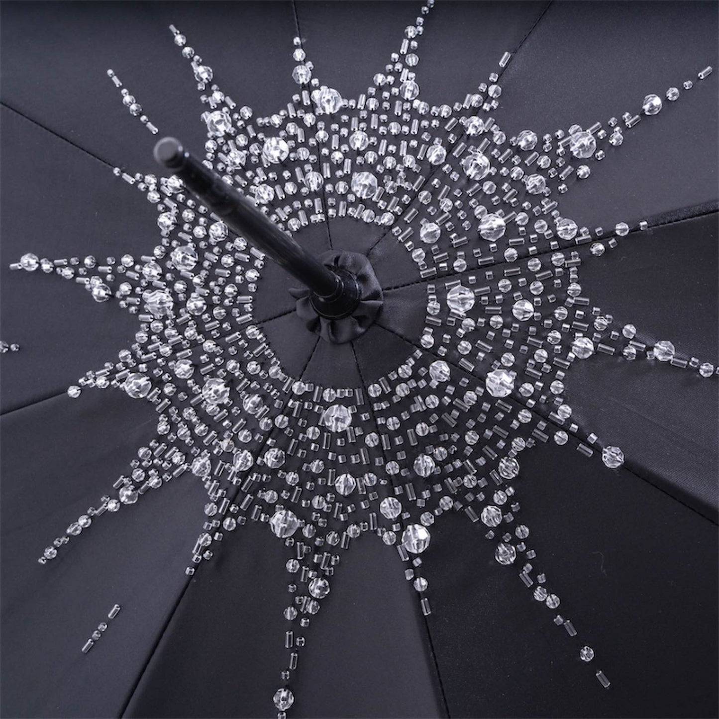 Luxury black women's umbrella with spectacular handle and hand-stitched Swarovski® crystals on the dome