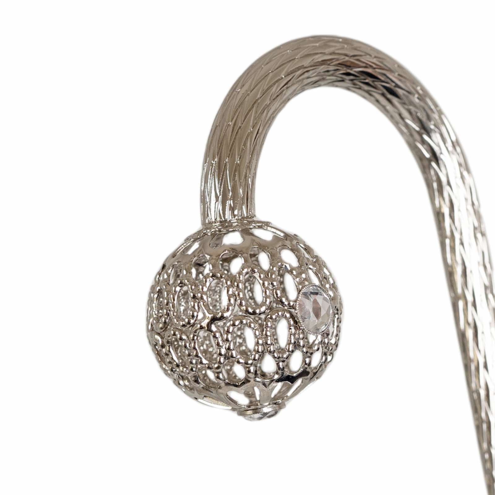 Close-up of jeweled brass handle on Pasotti white wedding umbrella