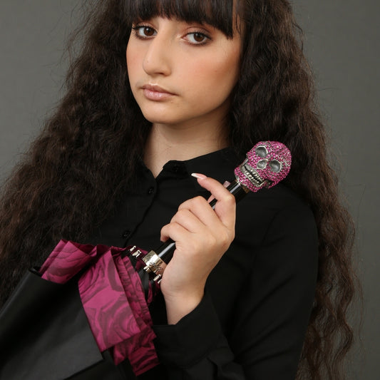 The girl is holding an umbrella with a skull with roses under the dome and a handle with Swarovski crystals - 2