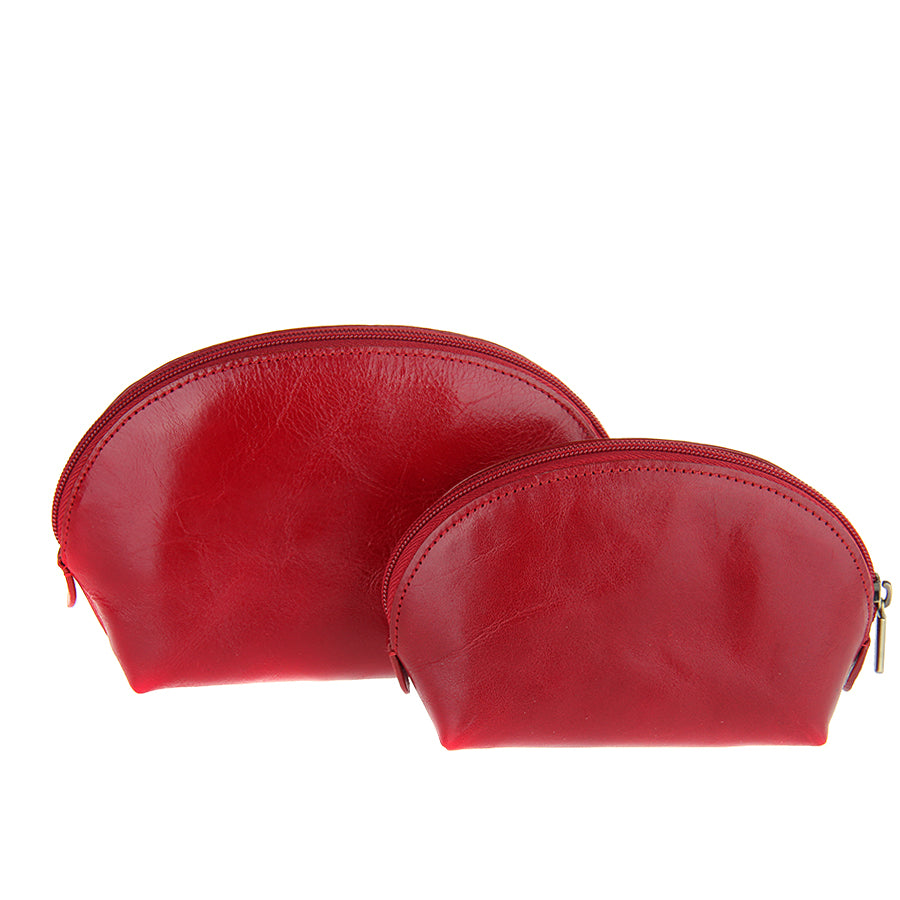 Two red leather pouches with gold zippers on a white background