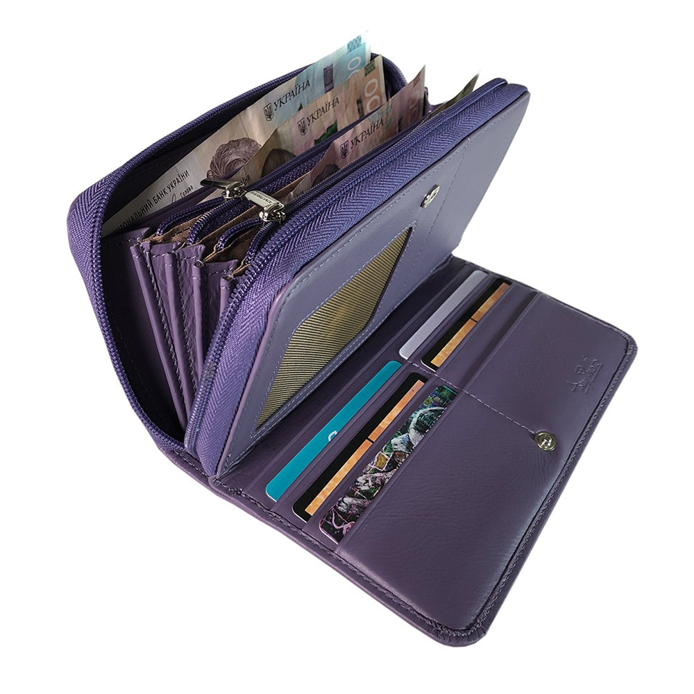 Tony Perotti women's purple leather zip-around wallet open to show various compartments with money and cards on a white background