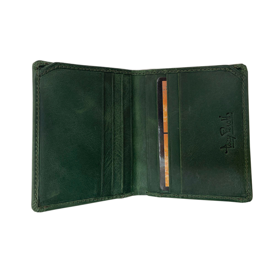 Tony Perotti Arno 1034N deep green leather card holder open with the card slots mostly empty, one card inserted, embossed Tony Perotti signature on the right panel