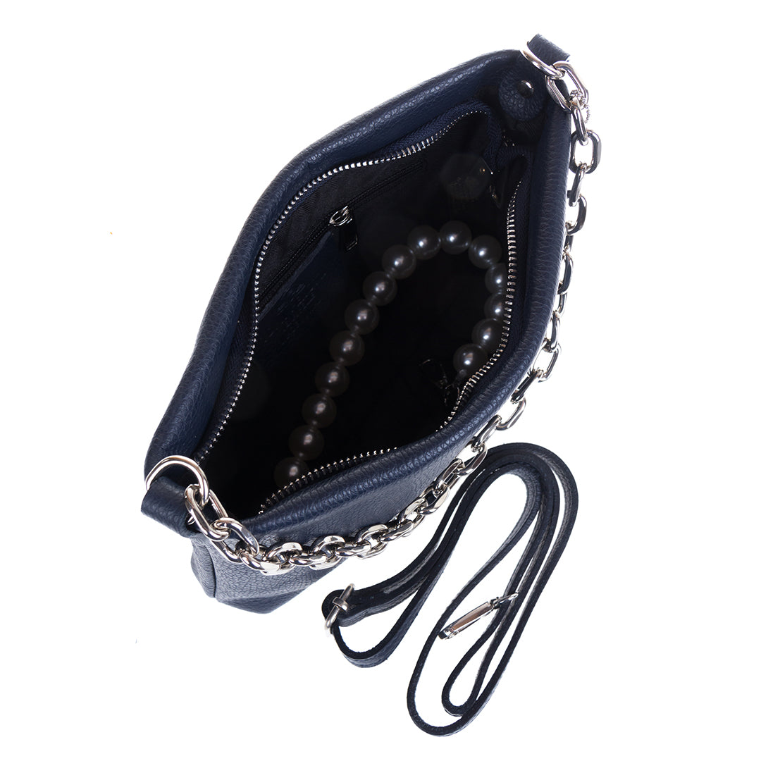 Tony Perotti Borsa CA045-01BL navy leather bag open from above beside its long narrow leather strap, with the pearl handle resting inside