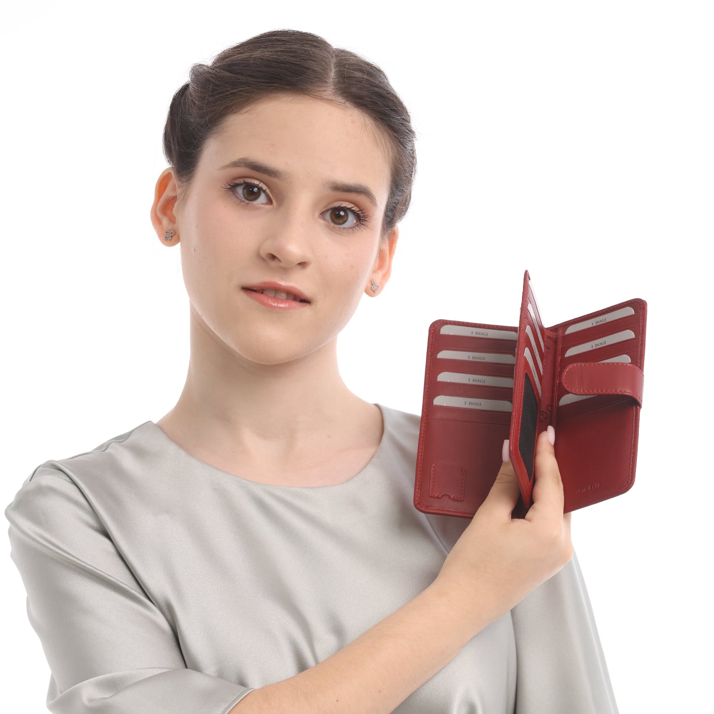 Model holding the red Tony Perotti Cortina 5074 wallet open, showing the two columns of card slots and the mesh ID window