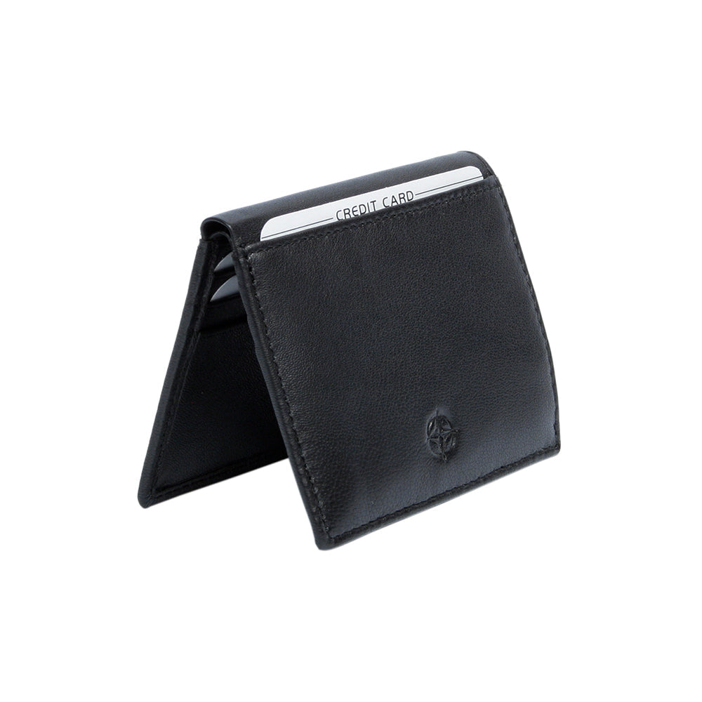Tony Perotti Cortina 5045 nero black leather card wallet standing half-open like a tent — cards in the slots on the inner panels and the compass rose on the front
