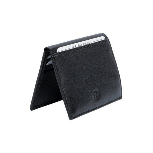 Tony Perotti Cortina 5045 nero black leather card wallet standing half-open like a tent — cards in the slots on the inner panels and the compass rose on the front