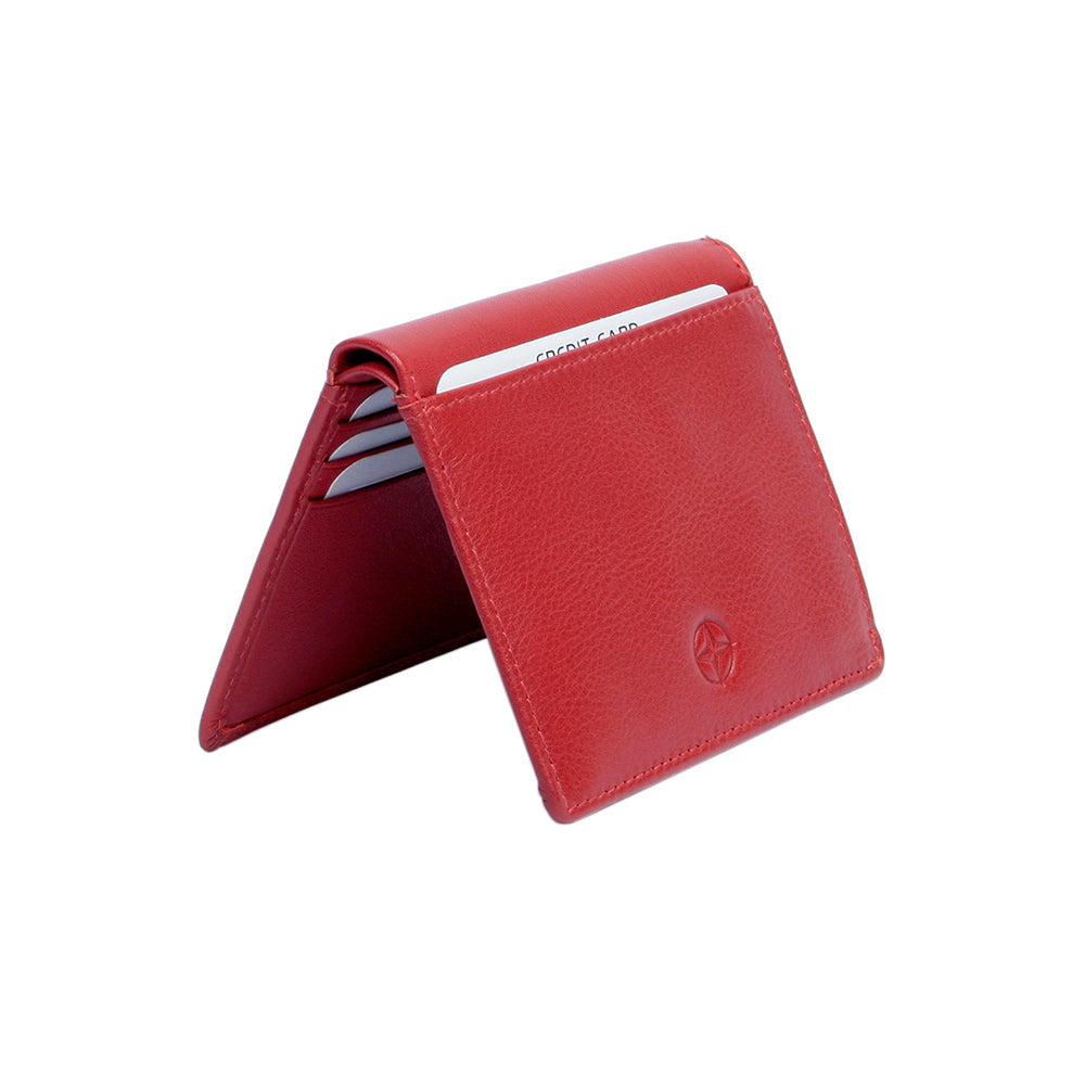 Tony Perotti Cortina 5045 rosso red leather card wallet standing half-open like a tent — cards in the slots on the inner panels and the compass rose on the front