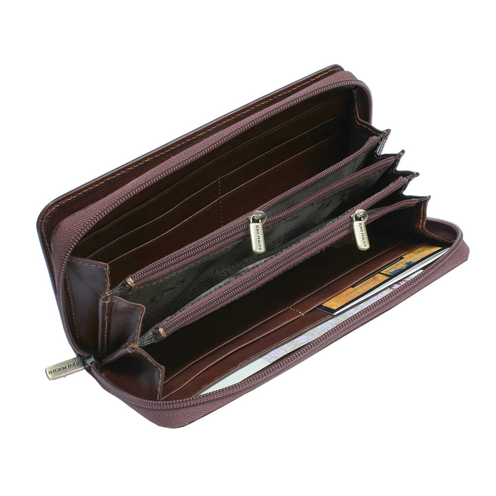 Brown leather wallet with multiple compartments on a white background