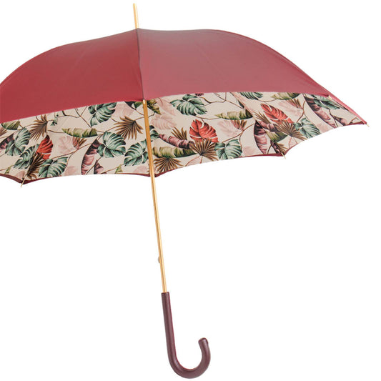 Open Pasotti burgundy umbrella showing tropical canopy design