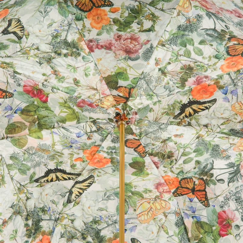 Umbrella with a floral and butterfly pattern on a white background
