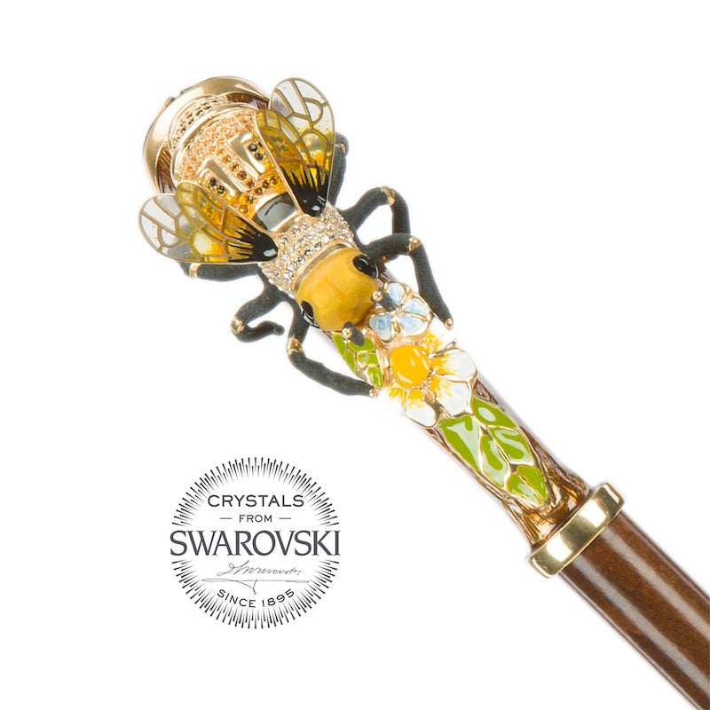 Decorative handle with bee design and Swarovski crystals on a white background