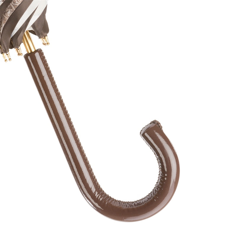 Close-up of brown leather curved handle of Pasotti cane umbrella