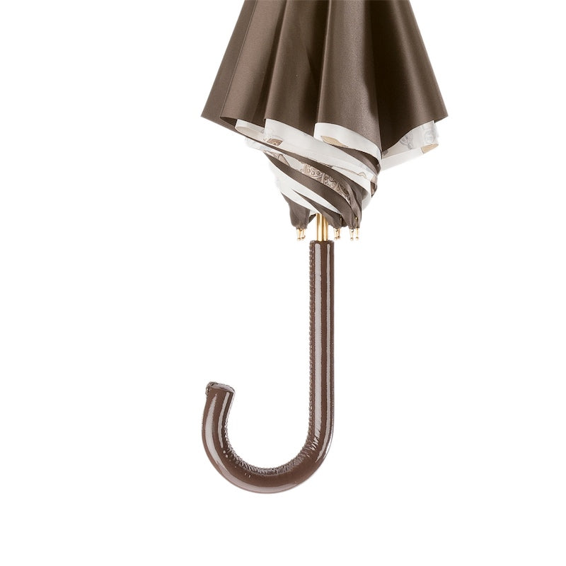 Brown umbrella with a white stripe on a white background