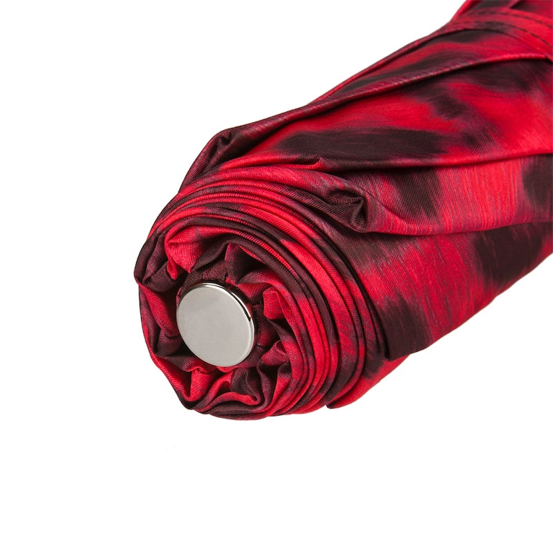 Detail of folded canopy fabric with red and black leopard print