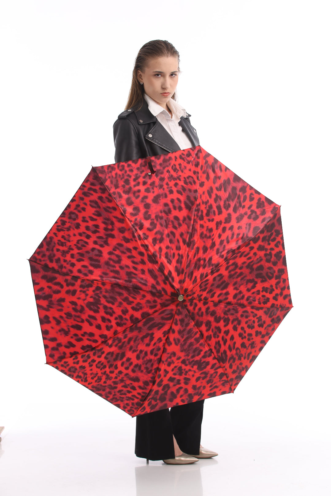 Model showcasing Pasotti red leopard print umbrella from the front