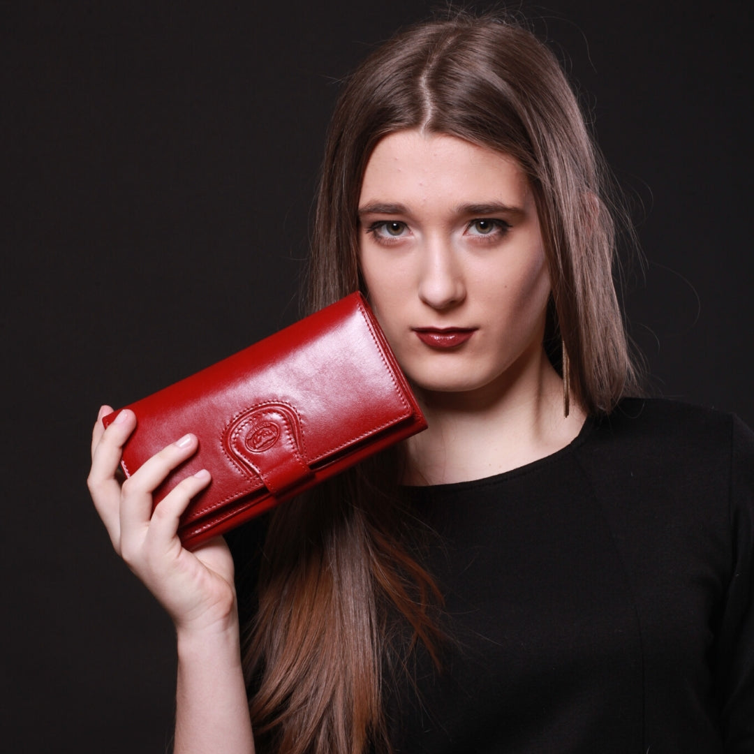 Tony Perotti Women’s Red Leather Wallet Accademia 1526 Rosso — lifestyle photo with model holding wallet