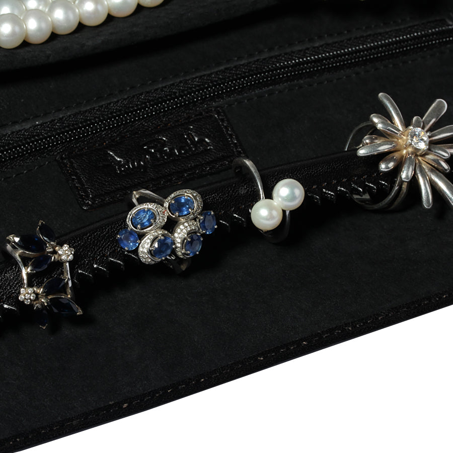 Close-up of the notched ring roll and the embossed Tony Perotti label inside the Italico 1286 nero jewelry case