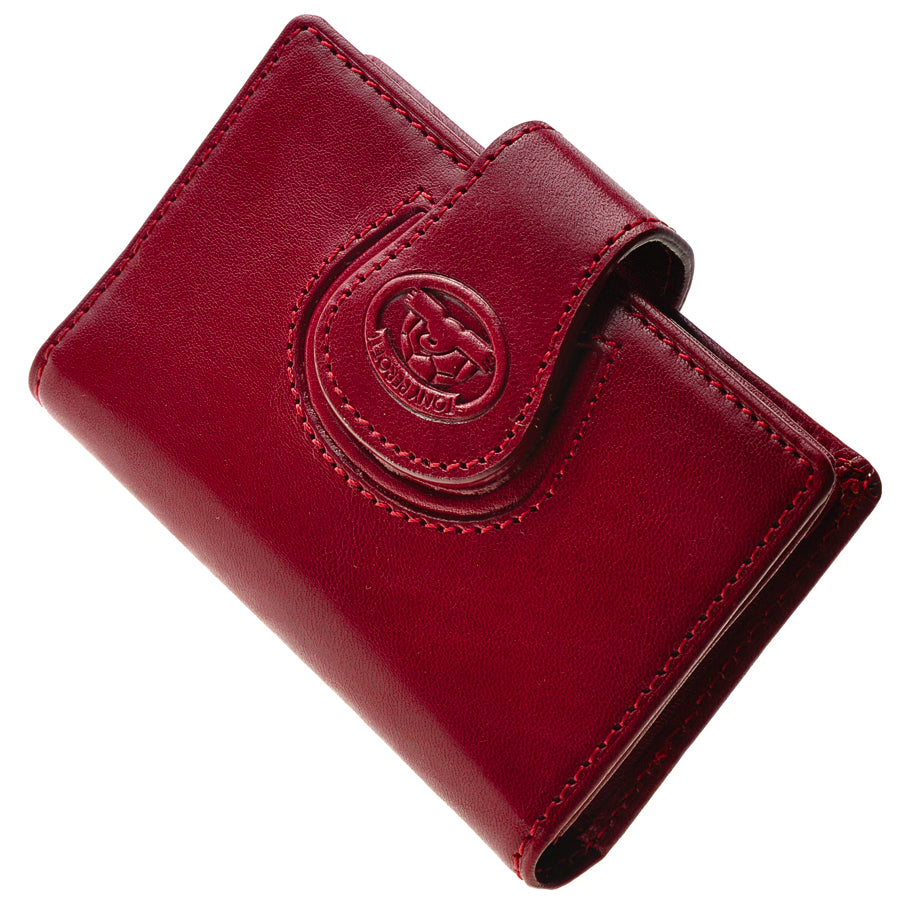 Close-up of the red Accademia 1440 flap clasp — the embossed Tony Perotti turtle on the snap tab through the leather loop
