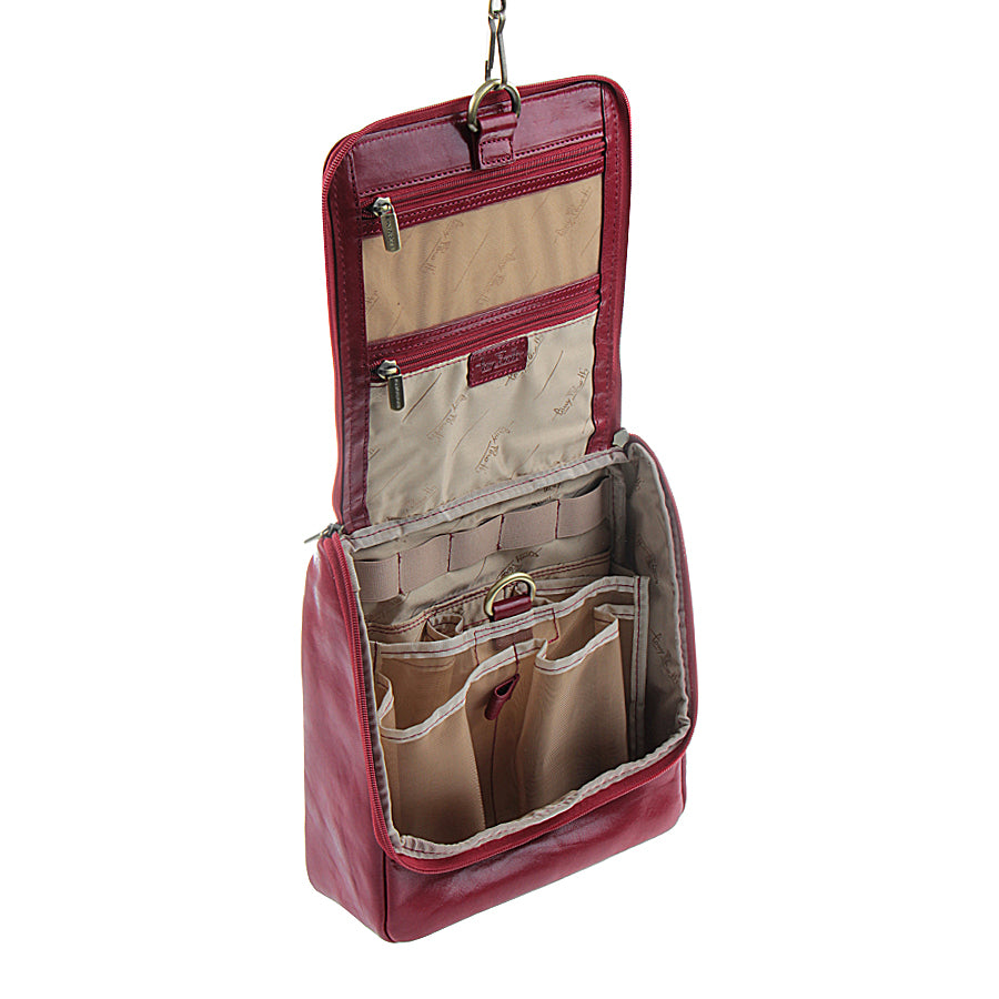 Tony Perotti Italico 8220 rosso toiletry bag hanging open — two zip pockets in the flap, bottle pockets and elastic loops