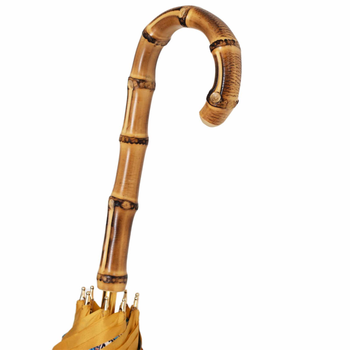 Natural bamboo crook handle in a warm honey tone with darker markings