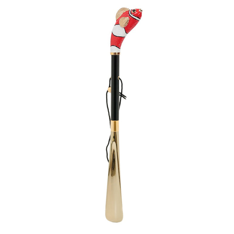 Red fish shoehorn standing upright: glossy black shaft, hanging cord and gold-tone blade