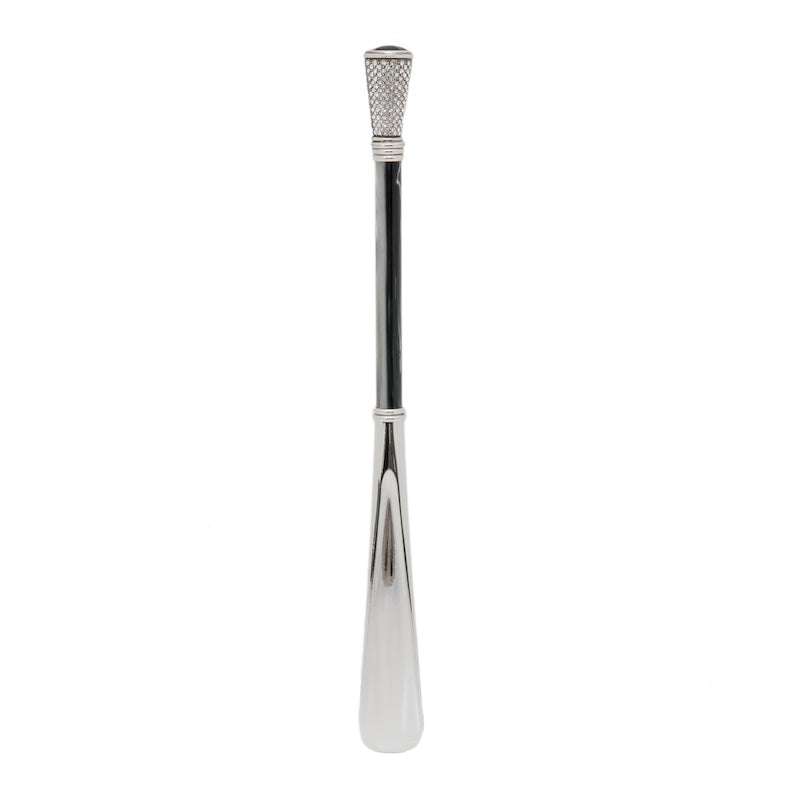 Crystal shoehorn standing upright: dark pearlescent shaft and silver-tone blade, handcrafted in Italy