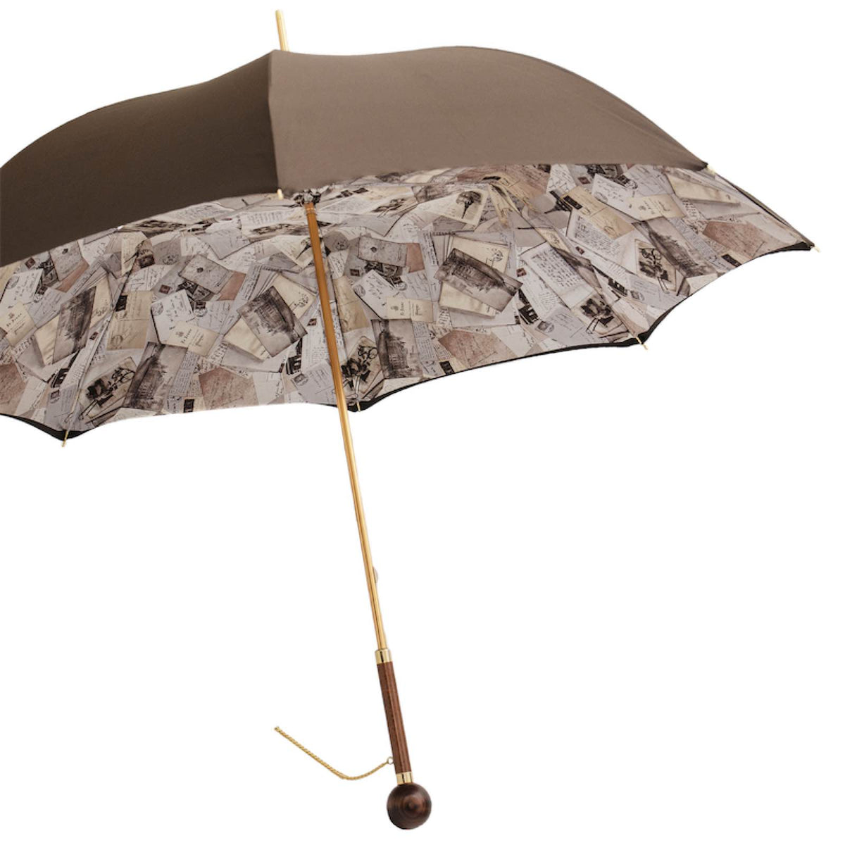 Open brown umbrella from the side with the postcard print inside and the wooden handle