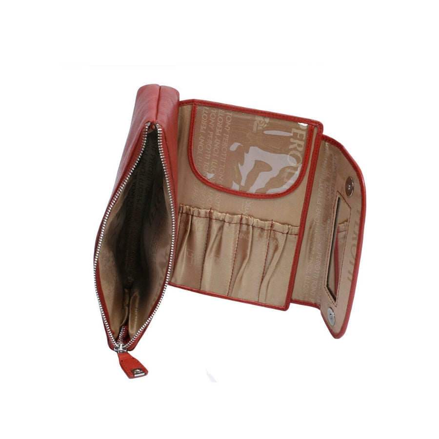 Open red leather cosmetic bag showing interior compartments and brush holders