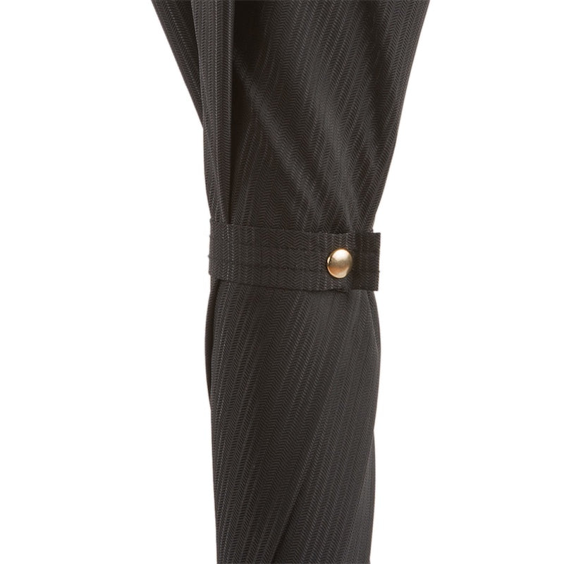 Furled canopy close-up: tonal herringbone weave and strap with gold-tone snap button