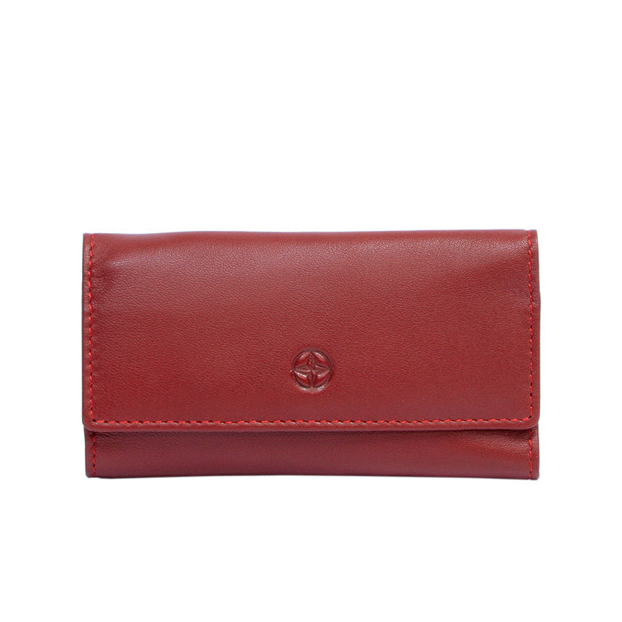Tony Perotti Cortina 5041 rosso — compact red leather key case closed, compass-rose emblem embossed on the flap and red topstitching