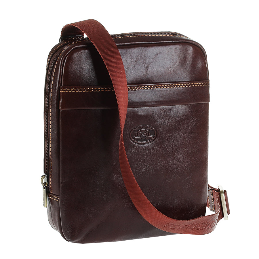 Angled view of the Tony Perotti Italico 6056 dark brown crossbody bag — glossy bull leather with light-beige stitching