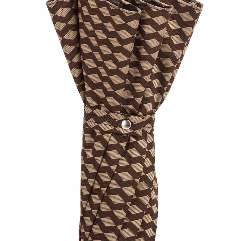 Fabric strap with silver-tone snap button on the furled geometric jacquard canopy
