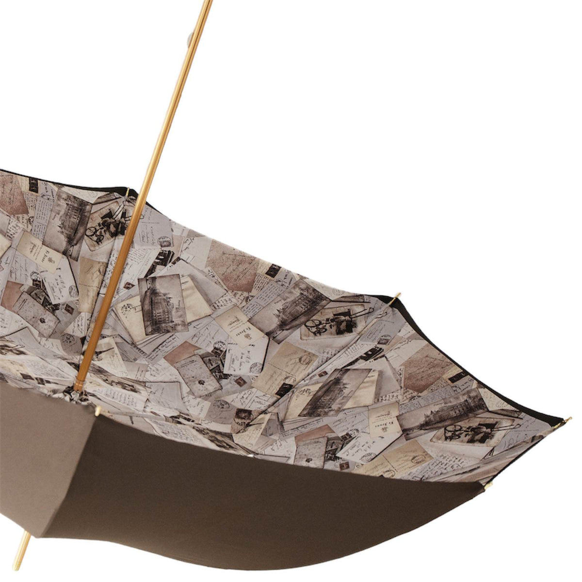 Underside of the open canopy with the postcard print and gold-tone shaft