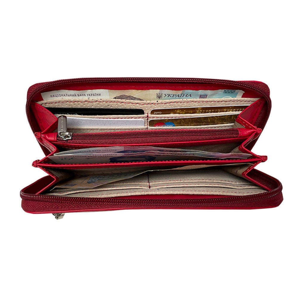Red Swarovski wallet open showing card slots and central zip coin pocket
