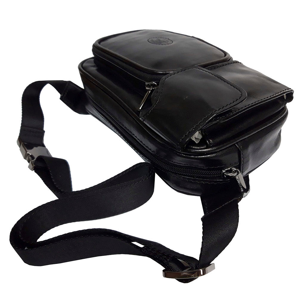Top view of the black Italico 8606 — the main zip, the flap pocket and the leather tabs that hold the belt