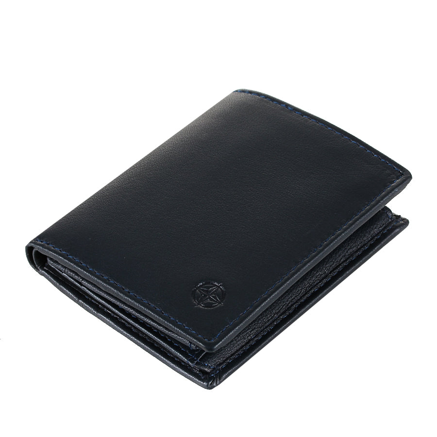 Navy Tony Perotti Cortina 5088 navy card wallet lying tilted — the closed fold and the embossed compass rose