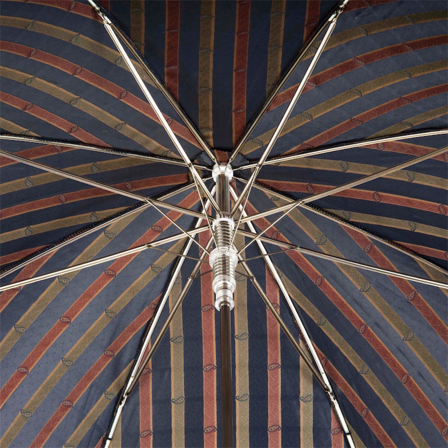 Underside of the canopy: diagonal stripes in navy, rust red and olive gold with tonal paisleys, eight ribs