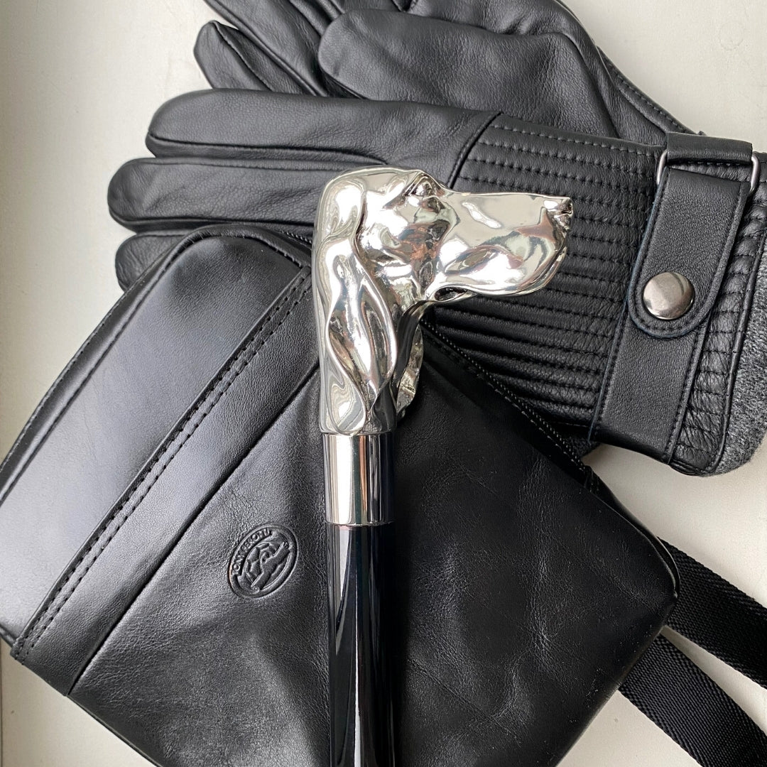 Black Italico 6056 bag styled with leather gloves and a silver-handled cane