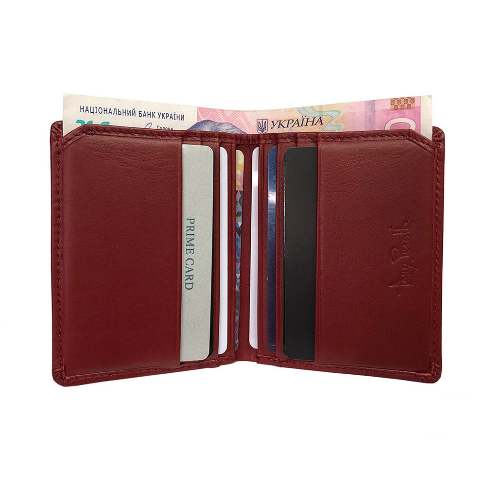 Tony Perotti New Rainbow 1034 rosso — opened out with cards in the slots on both halves and a banknote between them