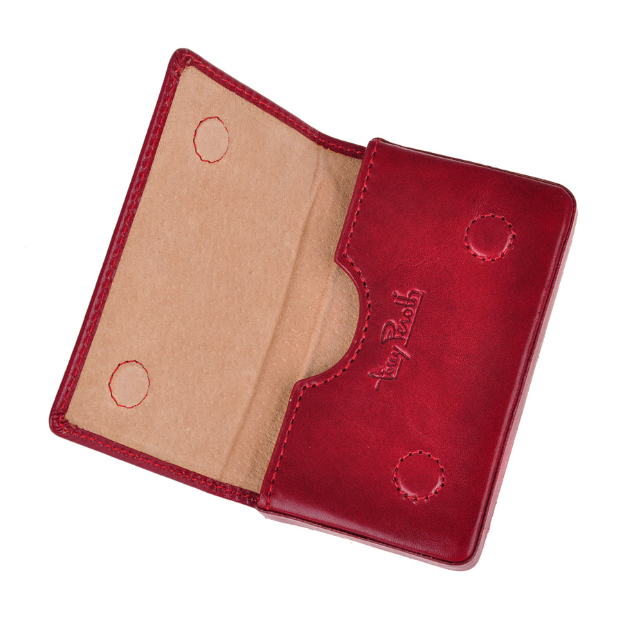 Red leather business card holder opened flat showing suede lining and stitched magnetic snaps — Tony Perotti Italico 2678 rosso
