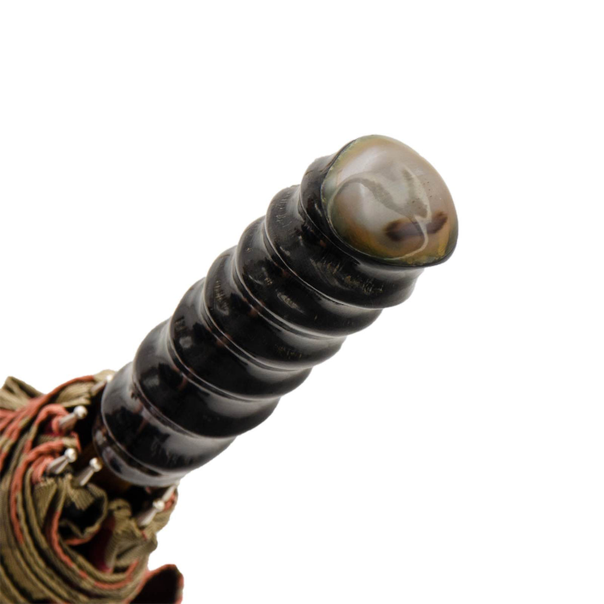 Ridged oryx horn handle with a lighter translucent top, close-up, handcrafted in Italy