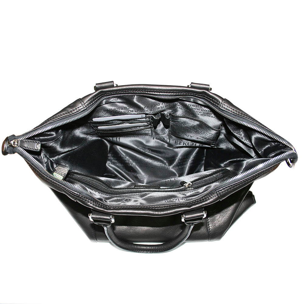 Inside the Tony Perotti Contatto 9217-31 nero handbag — silk lining woven with the repeating Tony Perotti name, zipped pocket, card slots and the hologram authenticity tag