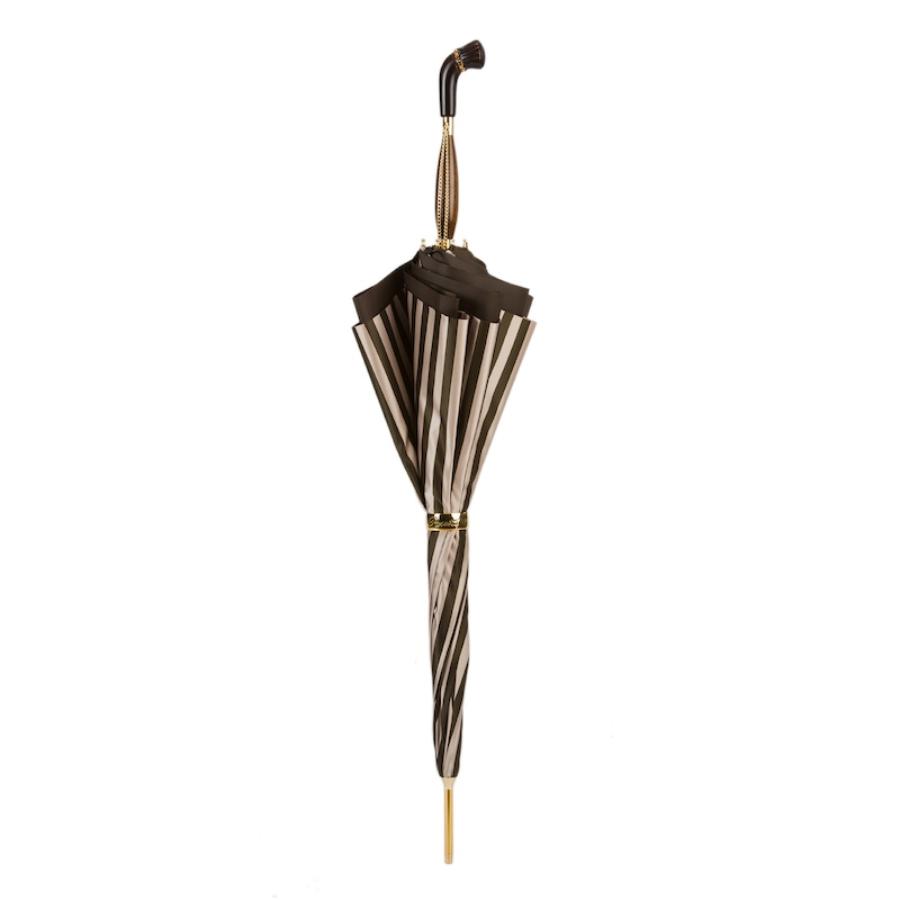 Closed striped umbrella standing upright with the wooden handle and gold-tone ring