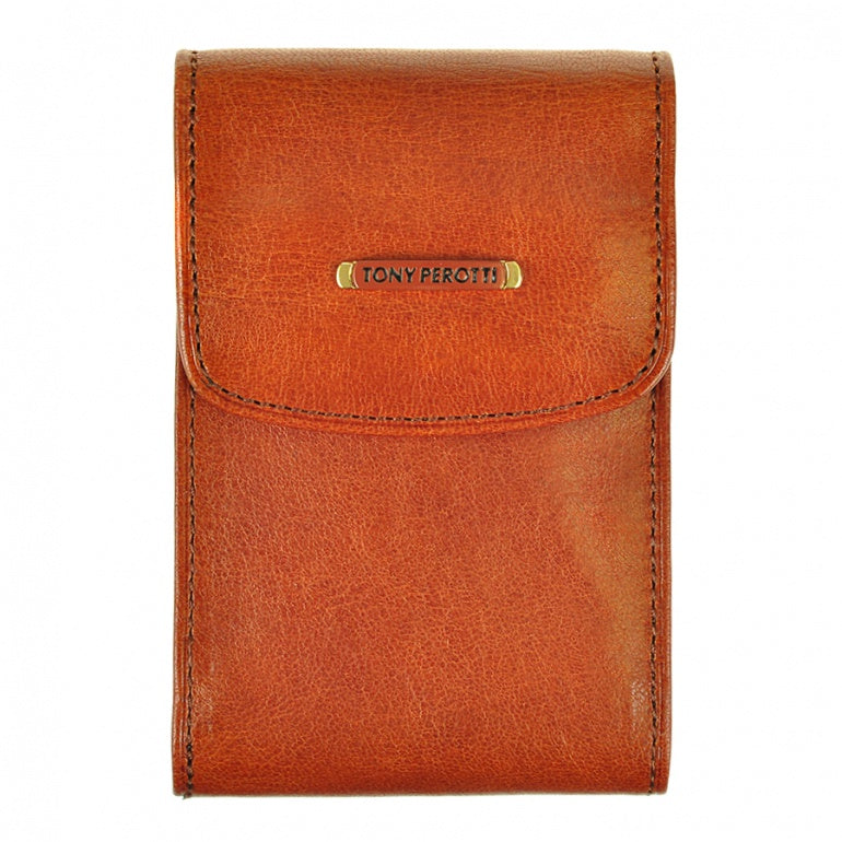 Tony Perotti Topkapi 1703 ambra — the amber-brown leather business card holder closed, with the gold-tone nameplate on the flap