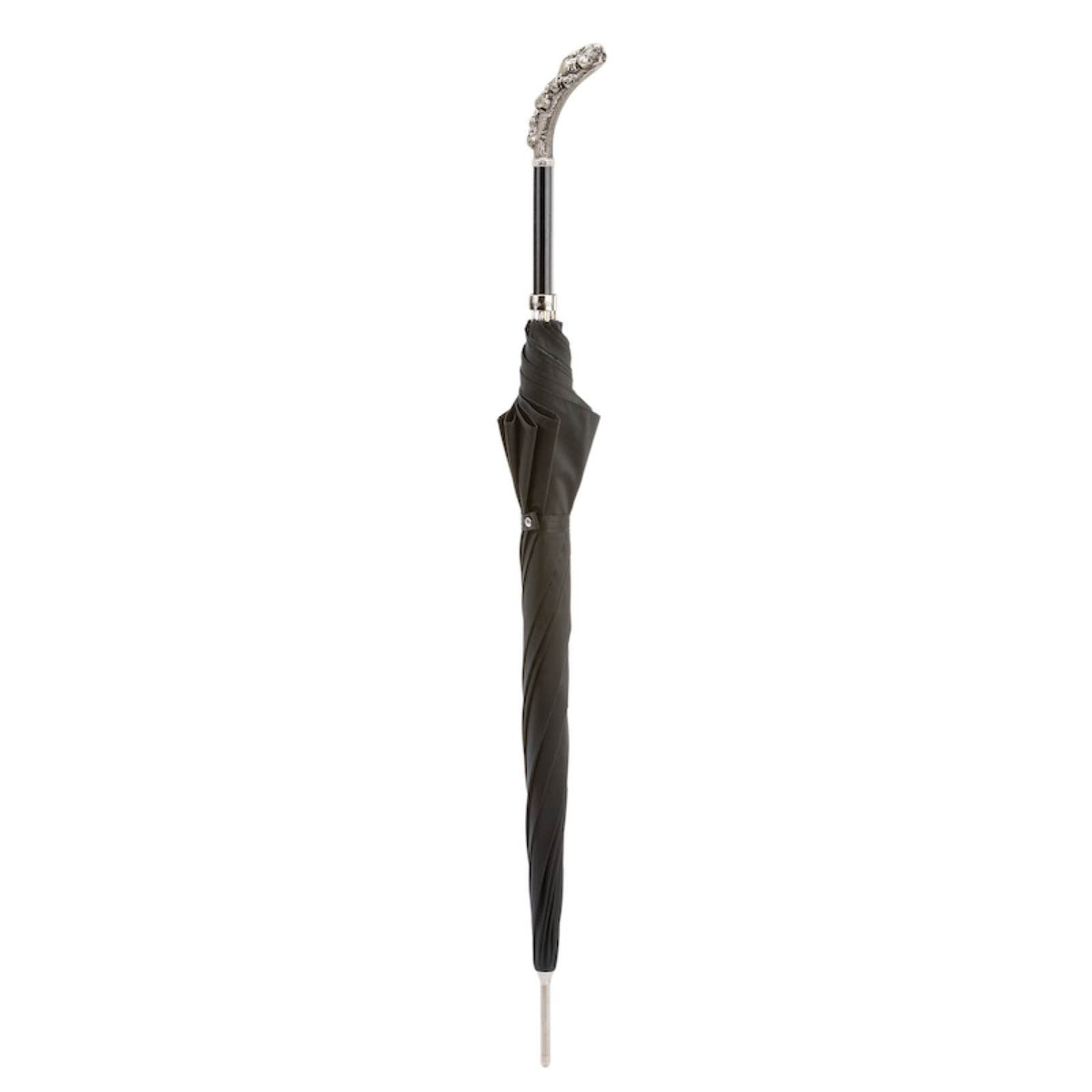 Closed black umbrella standing upright with the curved skull handle and silver-tone tip
